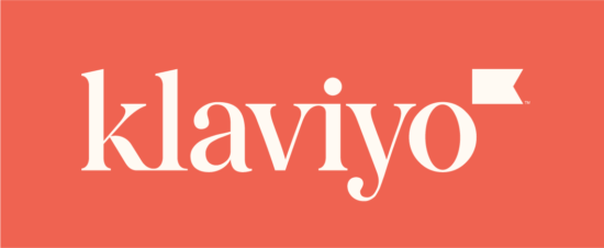 Klaviyo logo displayed on a coral background, featuring the brand name in a modern font with a flag icon.